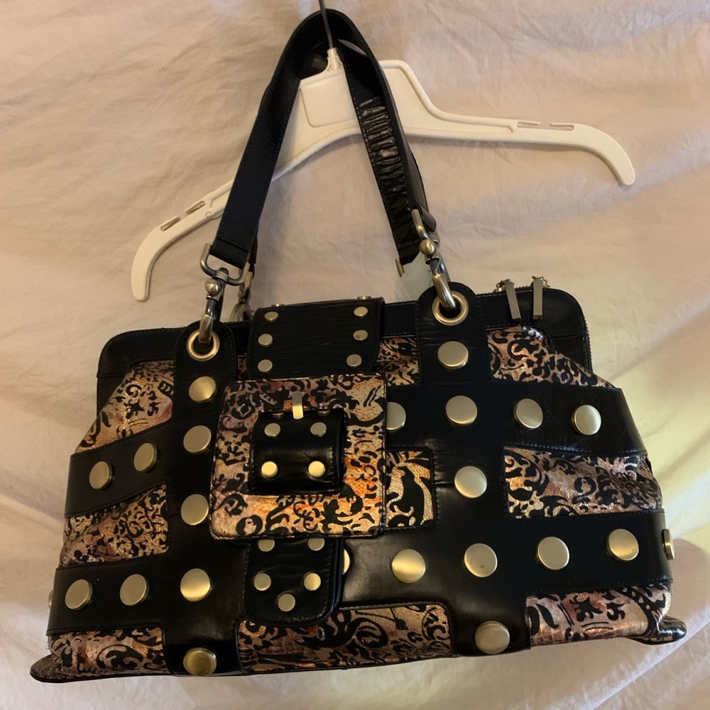 Elite style is yours with this ultra embellished studs paisley lustrous Handbag